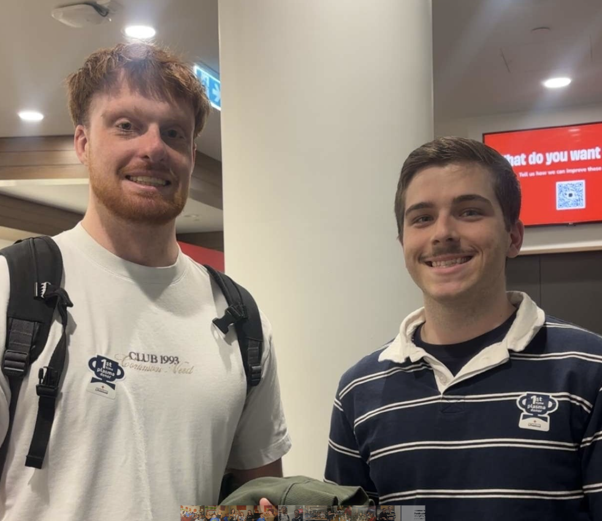Two students smiling after giving blood